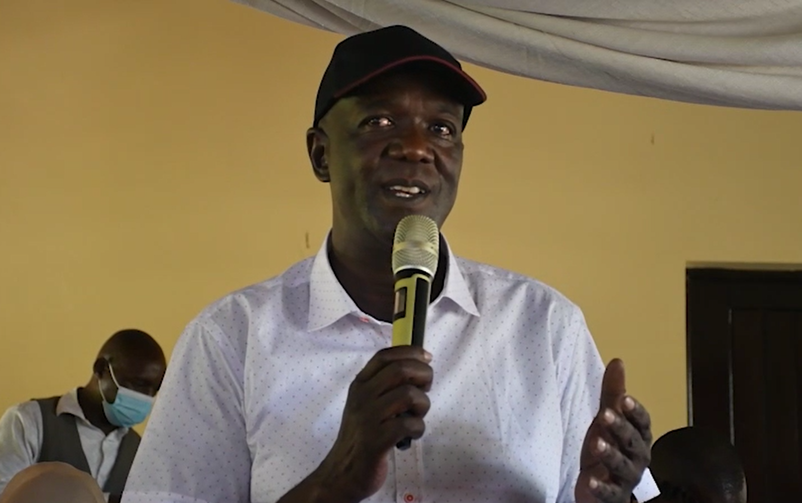 Gideon Mung'aro speaking at an event.